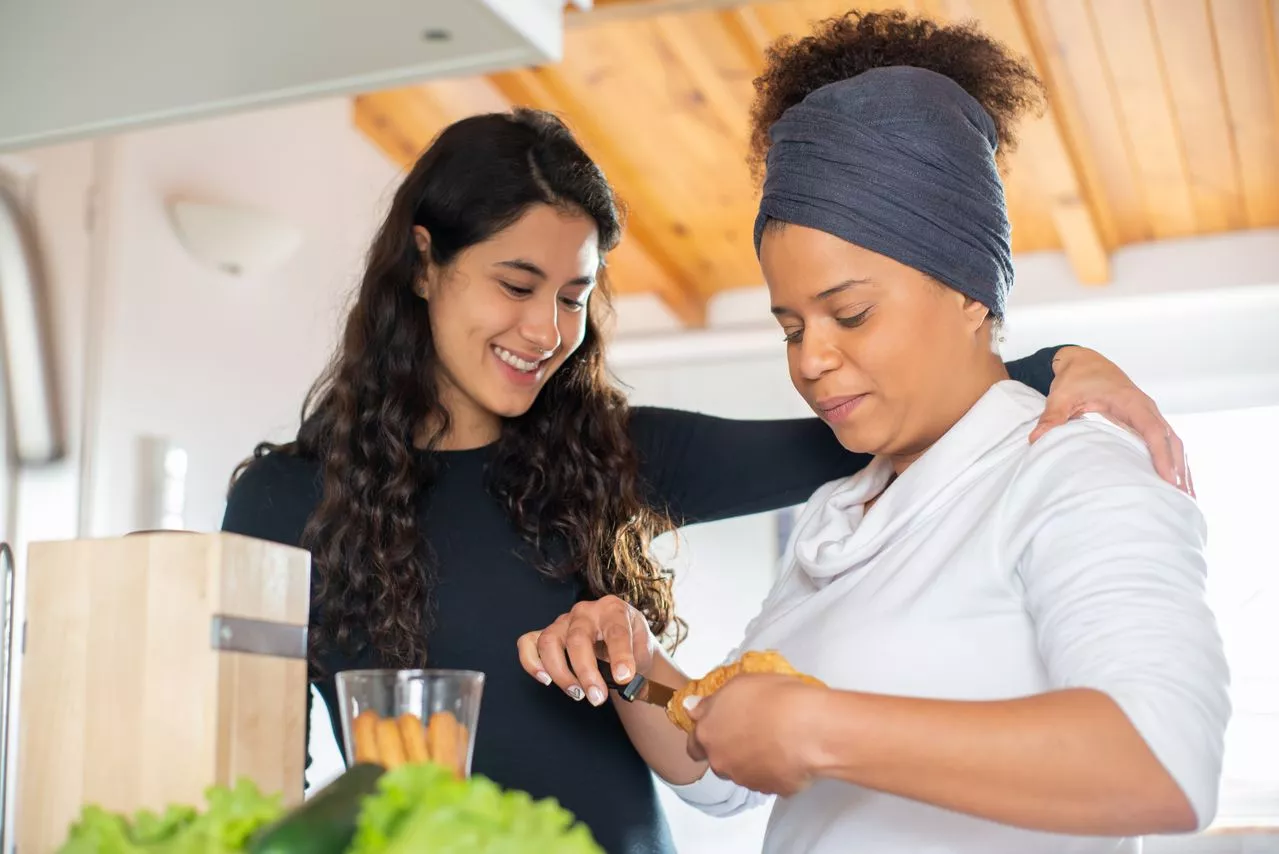 Caregiver preparing a healthy meal in the kitchen