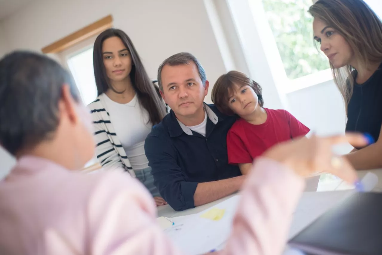 Family discussing care plan at home